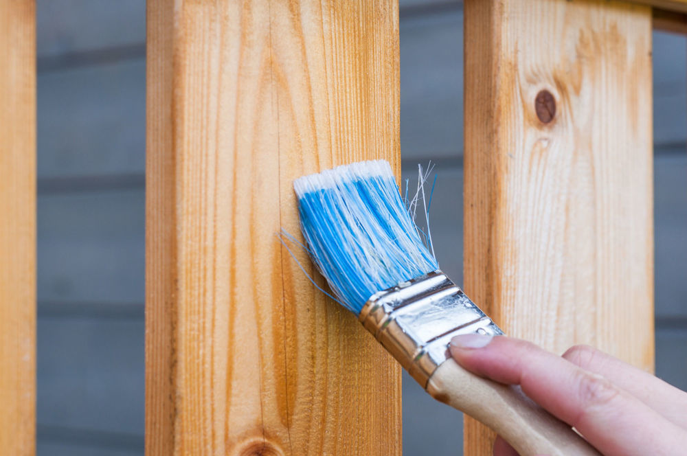 Applying a fence treatment